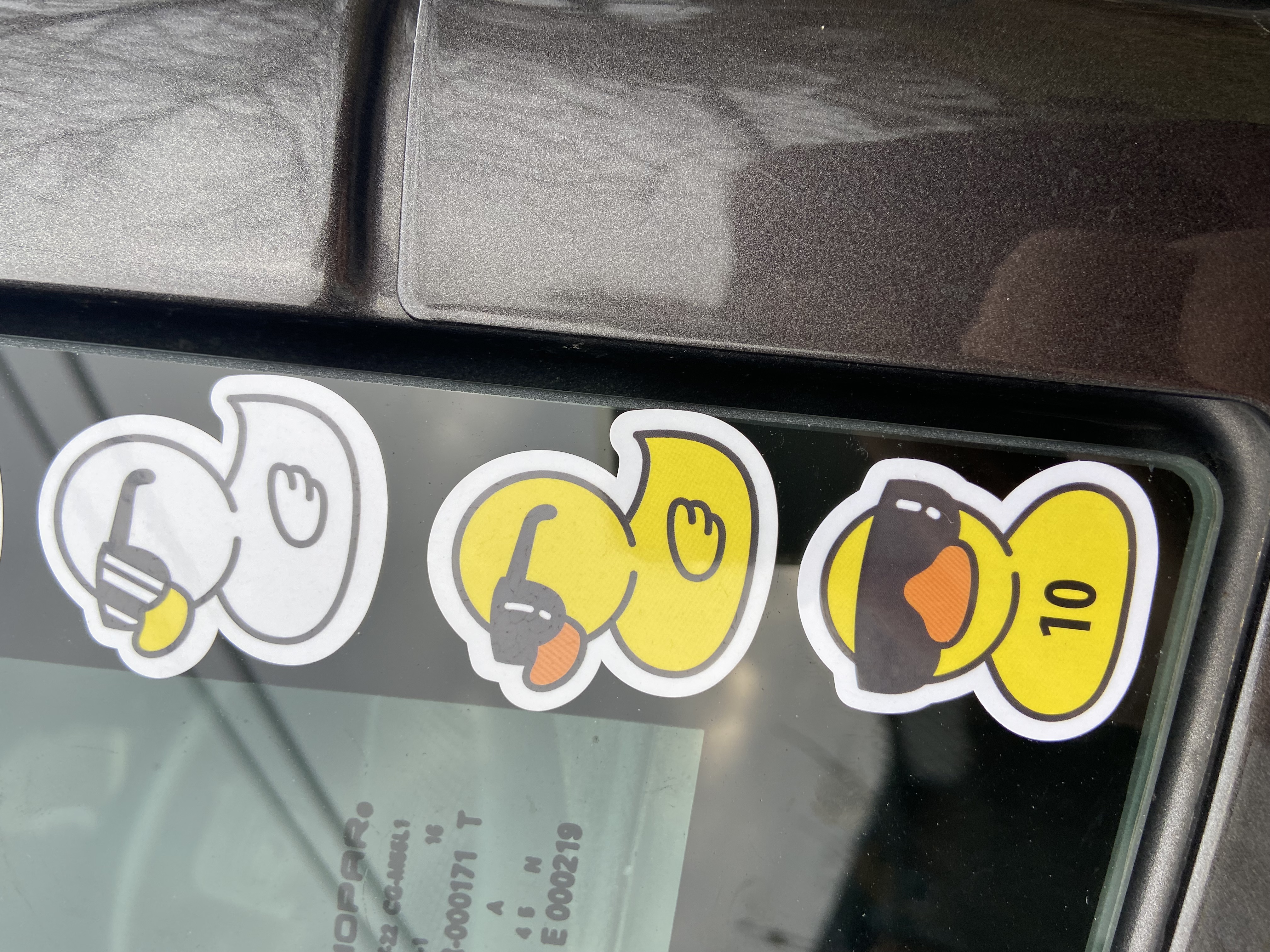 A Duck Stickers On A Car Window